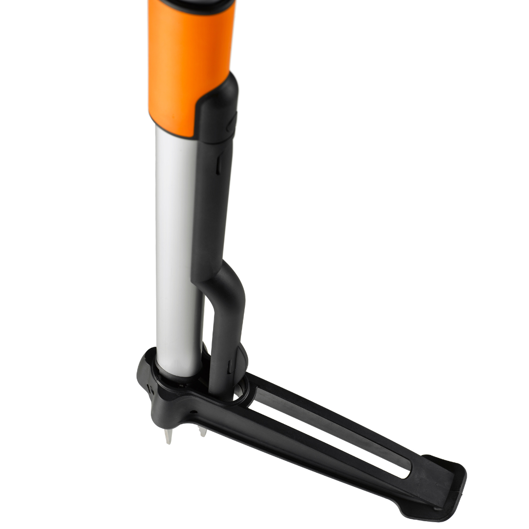 Gardening tool with orange handle and black metal prong on a white background