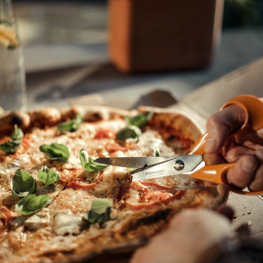 Fiskars universal scissors cutting food ingredients in kitchen