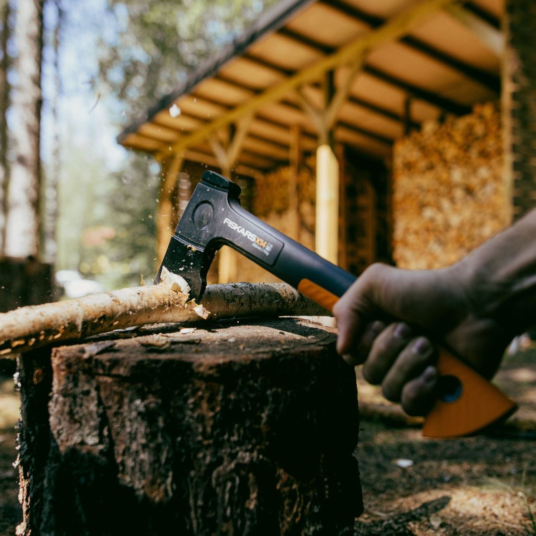 Fiskars wood chopping axe on a log – compact firewood axe for precision cutting”